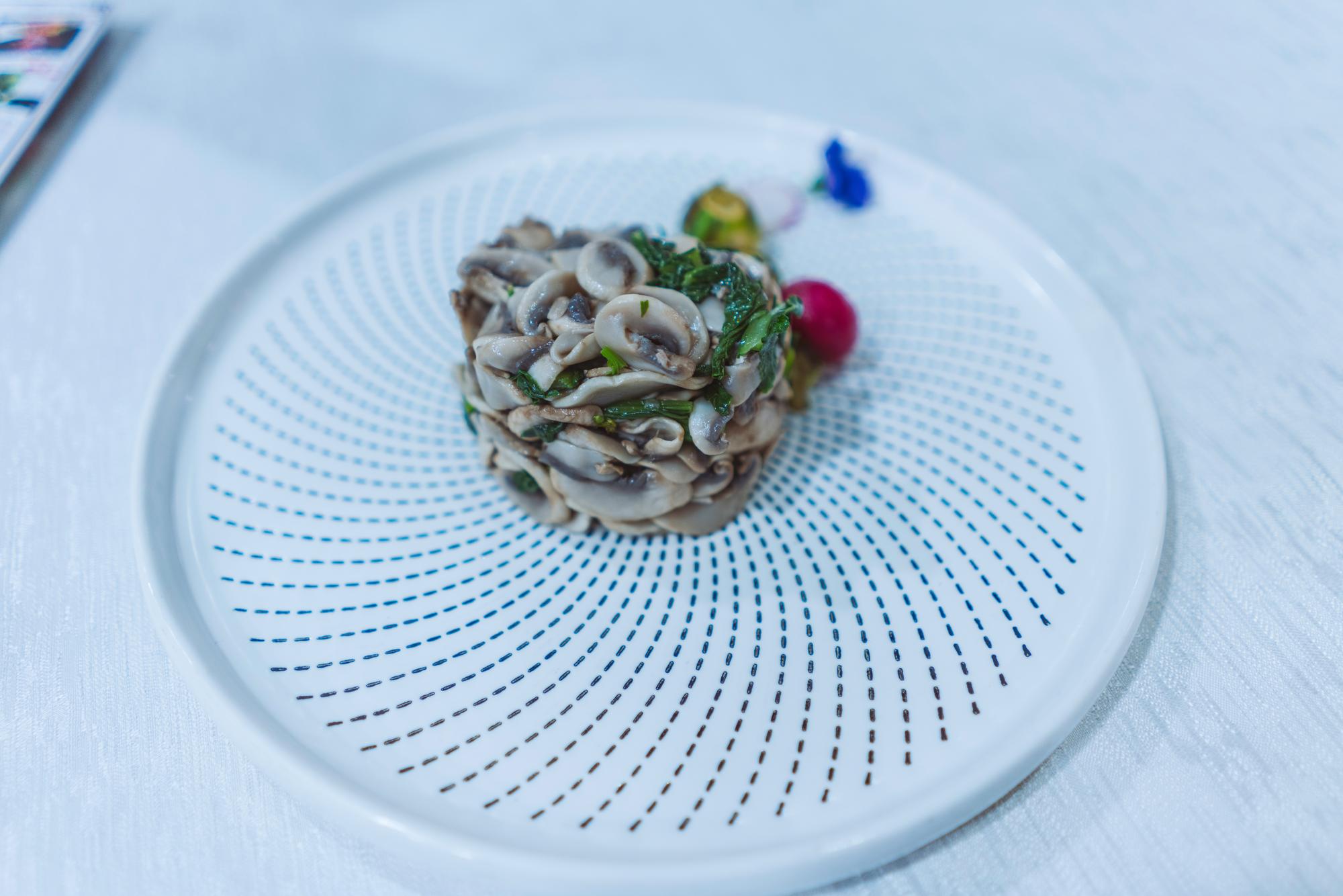 Large plated seasonal menu on neutral surface